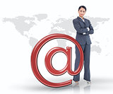 Businesswoman standing by red at email symbol