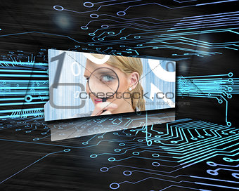 Screen showing woman with magnifying glass in circuit board