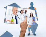 Hand selecting image of doctor holding apple in digital interface