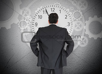 Businessman looking at clock