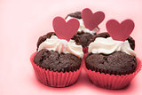 Three chocolate valentines cupcake with heart decorations