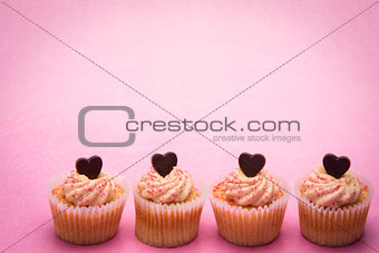 Four valentines cupcakes in a row