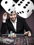 Handsome gambler with digital dice