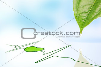 Dew drop falling from leaf onto green ECG line with heart symbol