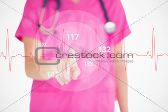 Nurse in pink scrubs touching red ECG line with figures