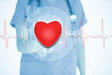Nurse in scrubs touching red ECG line with heart graphic