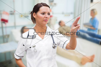 Nurse pressing on invisible screen