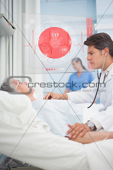 Doctor checking pulse of elderly patient beside screen displaying ECG data
