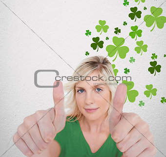 Girl in green tshirt giving thumbs up with copy space