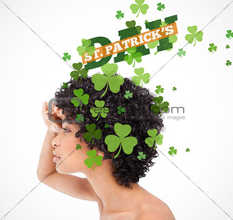 Girl looking into distance with shamrocks coming from her hair and st patricks day greeting