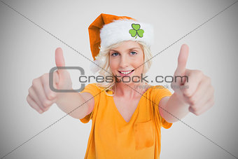 Girl in orange tshirt giving thumbs up