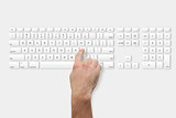 Hand pressing l key on keyboard