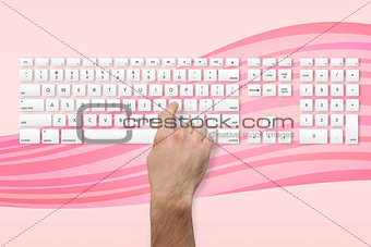 Hand pressing the l key on keyboard