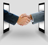Businessmen shaking hands from digital tablets