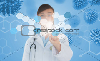 Brunette doctor pressing touchscreen displaying chemical formula and virus