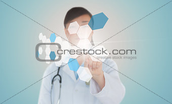 Brunette doctor pressing touchscreen displaying chemical formula