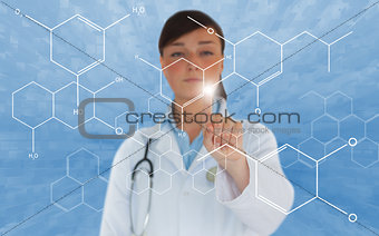 Brunette doctor touching screen displaying chemical formula