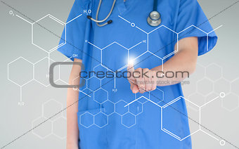 Nurse using touchscreen displaying hologram of chemical formula
