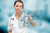 Serious nurse using a futuristic interface