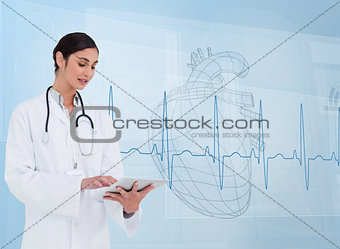 Cheerful cardiologist using a tablet pc