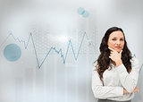 Businesswoman standing with a digital graph