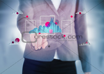 Businesswoman pointing to a graph on touchscreen
