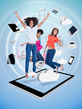 Three cute women jumping on a tablet pc