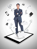 Businesswoman with crossed arms on a tablet pc