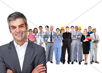 Smiling businessman ahead a group of people with different jobs