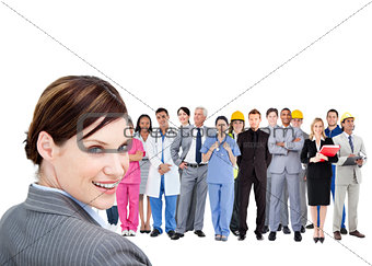 Smiling businesswoman ahead a group of people with different jobs