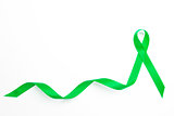 Green awareness ribbon with trail