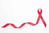 Red awareness ribbon with trail