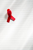 Awareness ribbon for aids on notepad