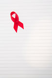 Awareness ribbon for aids on lined paper