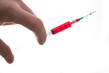 Hand holding syringe of blood