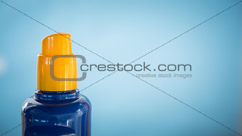 Spray bottle of sun cream with copy space