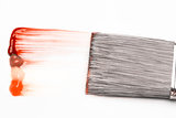 Paintbrush with a red and orange brush stroke