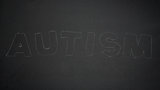 Autism spelled out in chalk
