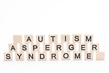 Autism asperger syndrome spelled out in plastic letter pieces