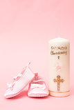 Christening candle with pink baby booties