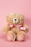 Teddy bear with pink ribbon