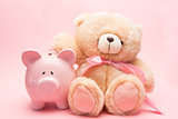 Teddy bear and piggy bank