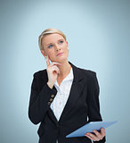 Thoughtful businesswoman with tablet pc