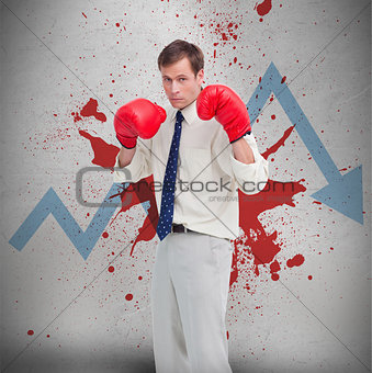 Businessman in boxing gloves against loss arrow and blood spatter
