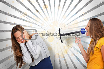 Girl shouting at her friend through megaphone