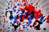 Blue and red paint splashes with black hand prints