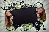 Girls pointing to black copy space with artistic black swirls