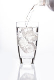 Sparkling water filling glass