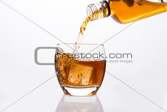 Whisky pouring into glass