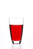 Glass filled with red liquid